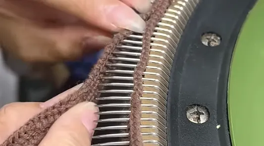 In-house hand-linking process for sweaters in a BSCI-audited compliant workshop