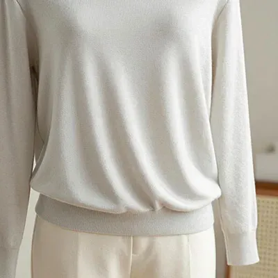 High-end 18G knitwear draping on mannequin with soft side-lighting to show fine texture and luster