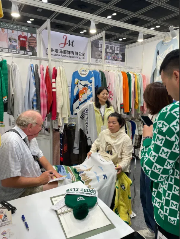 Knitwear sourcing discussion at Fashion InStyle HK with JM Sweater manufacturing experts