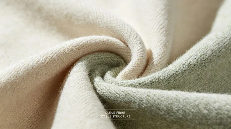 Macro detail of 100% natural fiber knitwear fabric texture meeting AGEC transparency standards